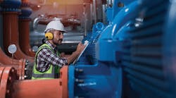 worker-checking-pipe-flow-measurements