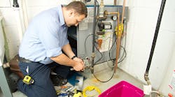 technician-working-on-a-furnace